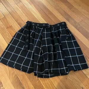 Pleated black plaid schoolgirl skirt with belt